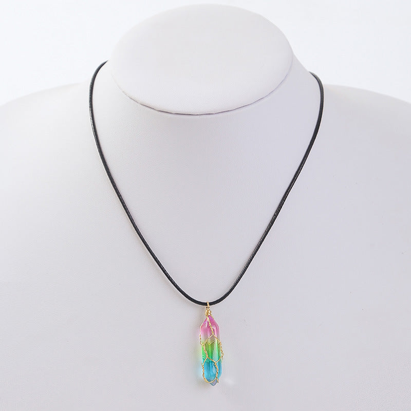 Rainbow crystal pendant necklace on black cord displayed on white bust – minimalist colorful jewelry for women